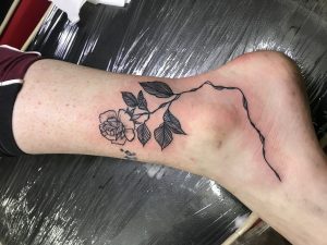 Rose Tattoo in foot, Tattoo artist in Nepal